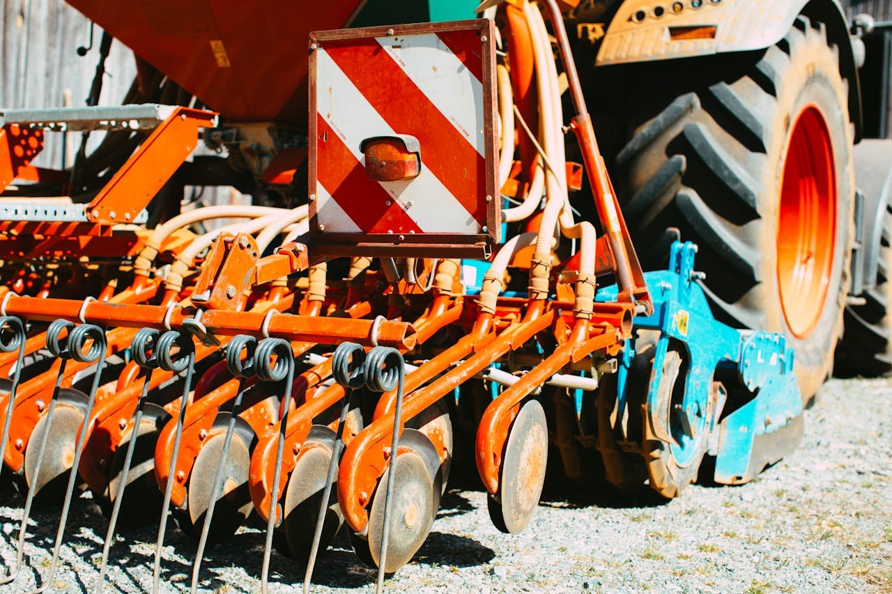 Detailed view of farming machinery showcasing tractor and cultivator parts.